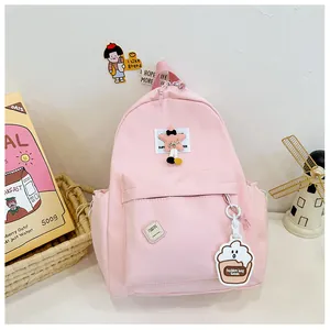 Pink nylon kids backpack with star embroidery and cute cloud pendant for school