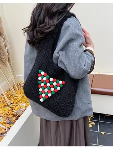 Detail of Christmas plush tote bag featuring festive pom-pom pattern on soft faux fur