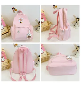 Pink cartoon nylon backpack with star patches and side pockets from four angles