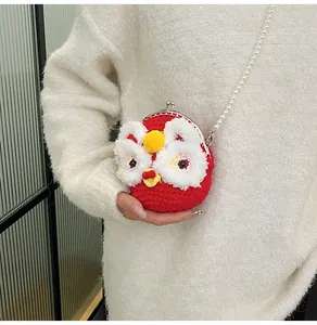 Close-up of handmade red knit lion dance purse with pearl strap and metal clasp