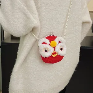 Handmade red knit lion dance mini bag with pearl chain strap and metal clasp detail