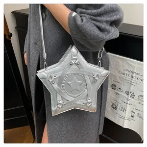 Detail of silver star-shaped shoulder bag with metallic finish and rivet straps