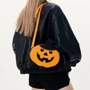 Unique orange pumpkin shoulder bag with wizard hat for Halloween, worn with black leather jacket