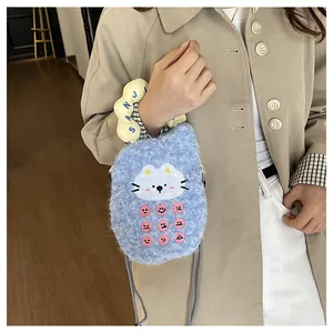 Detail of blue plush crossbody bag with cat embroidery and unique calculator dots