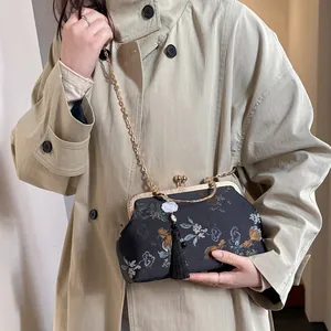 New Chinese shell bag with floral koi print, metal chain strap and tassel detail