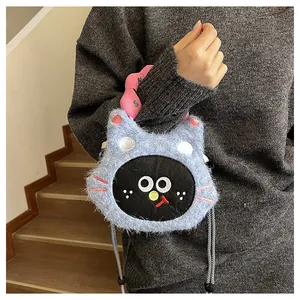 Detailed plush texture of blue cat-shaped shoulder bag with pink wavy handle