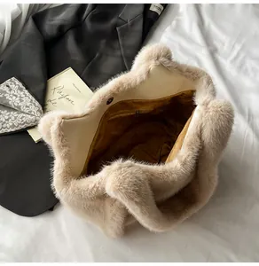 Top view of beige faux fur tote bag showing plush texture, magnetic closure and inner pocket