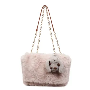 Pink plush crossbody bag with golden chain strap and a cute grey rabbit charm