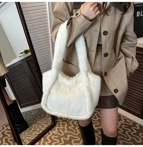 Detail view of a white fluffy plush tote bag showing the soft faux fur texture and handle