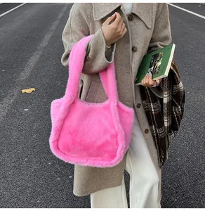 Close-up of vibrant hot pink faux fur tote bag showing soft plush texture and thick handle