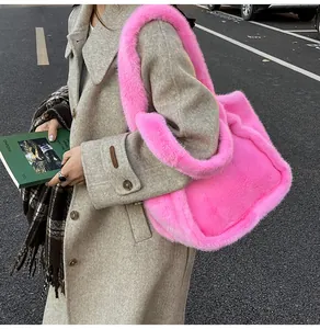 Close-up of fluffy bright pink plush tote bag featuring soft faux fur texture and wide strap