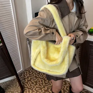 Fuzzy faux fur tote bag in bright yellow plush material for winter fashion outfits