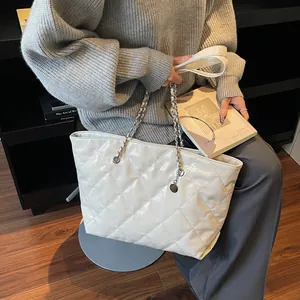 Off-white quilted tote bag with diamond stitching and silver chain strap for women