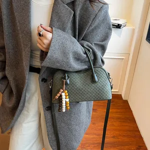 Dark green woven checkered handbag with retro wooden beads and a long shoulder strap