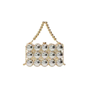 Spherical beaded handbag with silver mirror balls and gold chain trim for evening wear