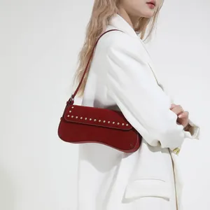 Red vintage underarm bag with silver rivets and matte suede finish for women
