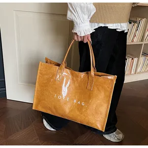 Detail of a large brown DuPont paper tote bag with white lettering in a stylish home setting