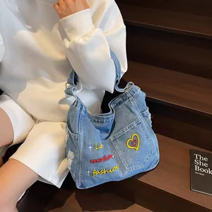 Retro denim tote bag with colorful letter embroidery and adjustable shoulder strap