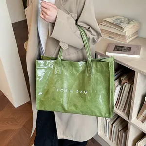 Green Tyvek tote bag with large capacity and white TOTE BAG lettering for women