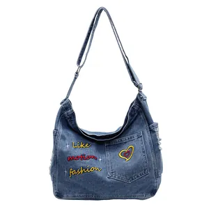 Vintage blue denim hobo bag with colorful letter embroidery and adjustable strap