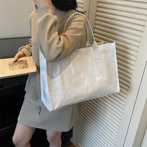 Large white waterproof Dupont paper tote bag with embossed TOTE BAG lettering for women