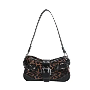 Chic faux fur leopard print crescent shoulder bag with black leather trim and buckle