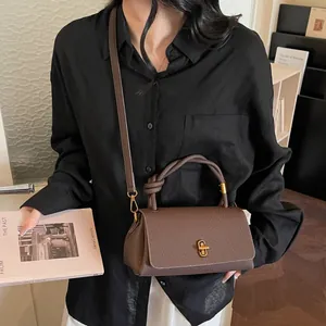 Retro dark brown litchi pattern leather handbag with gold twist lock for women