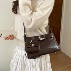 Dark brown patent leather underarm bag with mini coin purse and silver metal hardware