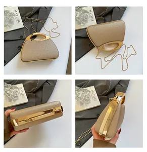 Macro view of gold glitter evening clutch with polished metal handle and chain strap