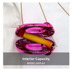 Internal capacity of mini metallic pink crescent bag showing space for a lipstick