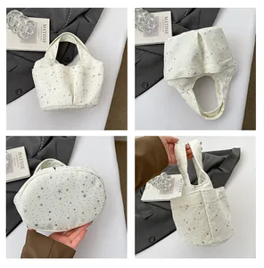 Viste dettagliate della borsa in tela beige con stelle d'argento e multi-tasche