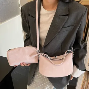 Light pink matte leather hobo bag set with crossbody strap and matching clutch pouch