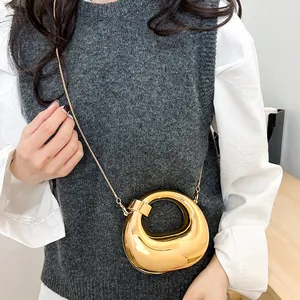Mini gold mirror crescent bag with unique ring design and elegant metal chain strap