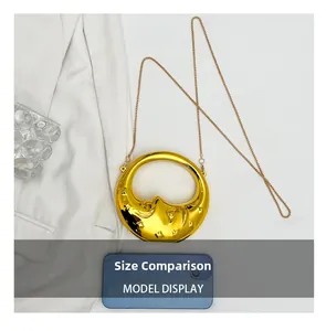 Size comparison of a golden crescent moon handbag with star embossing and chain strap