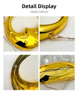Detailed views of gold crescent moon clutch with mirror finish and facial relief