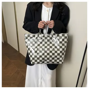 Close-up of checkerboard tote bag with transparent PVC layer and printed text details