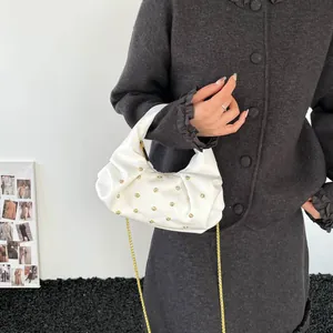 Chic white pleated handbag with gold rivets and chain strap, fashion shoulder bag style