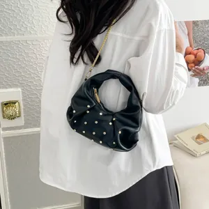 Fashionable black pleated handbag with silver studs and golden chain strap for women