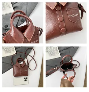 Close-up of brown faux leather mini handbag with creative shirt design and collar detail