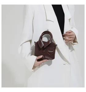 Detail view of mini dark brown handbag featuring unique shirt collar design and buttons