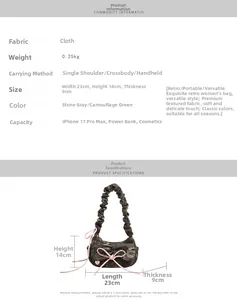 Detailed dimensions of camo baguette bag with ruffle handle and pink bow accents