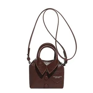 Vintage dark brown shirt-shaped handbag in glossy PU leather with retro button details