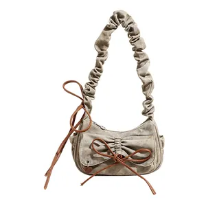 Vintage Y2K baguette bag with pleated strap and bow detail in washed grey canvas