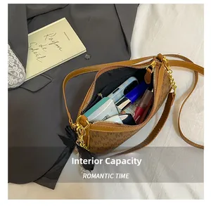 Internal capacity of brown monogram shoulder bag with phone and cosmetics