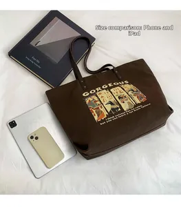Brown canvas tote bag compared with iPad and iPhone showing large storage capacity