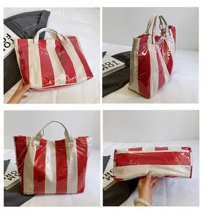 Detailed four-way view of red and white striped waterproof tote bag with PVC coating
