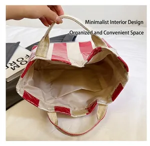Close-up of a striped tote bag interior featuring a spacious compartment and open inner pocket