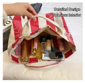 Detail of red striped tote bag interior showing spacious capacity for daily cosmetics