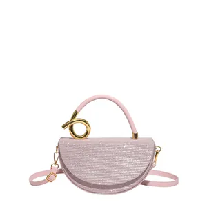 Pink semi-circle glitter handbag with sequin finish and gold knot ring metal detail