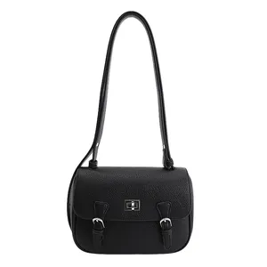 Classic black leather satchel bag with silver twist lock and pebble texture finish